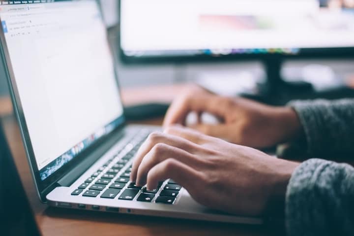 Laptop and planning notes for logistics coordination