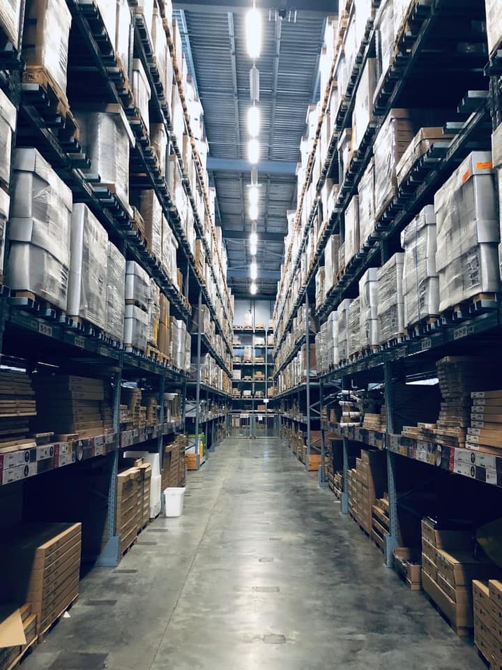 Forklift moving pallets in a distribution centre