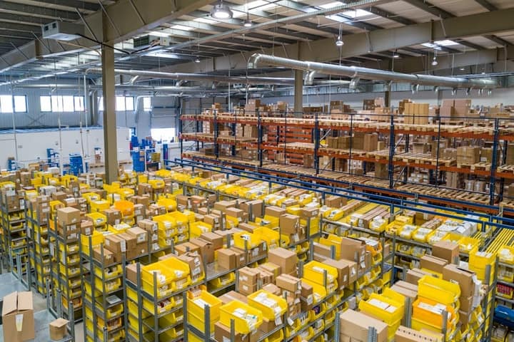 Cardboard shipping boxes stacked in a warehouse